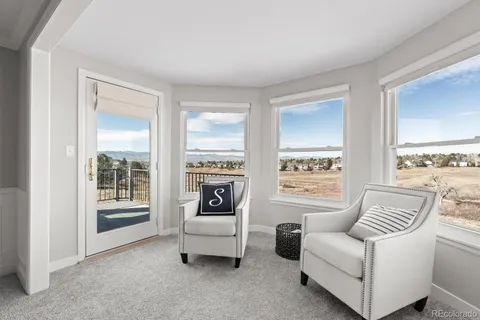a view of a balcony with wooden floor space