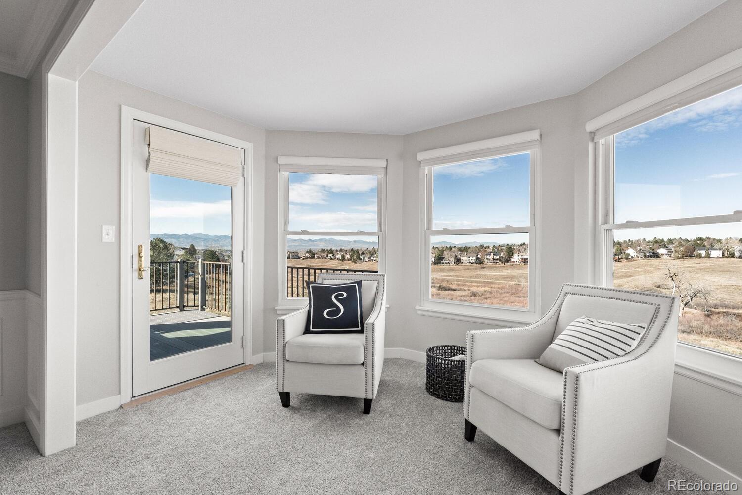 8855 South Wild Iris Run Highlands Ranch, CO 80126 - Photo 22 of 48 a living room with furniture and a window