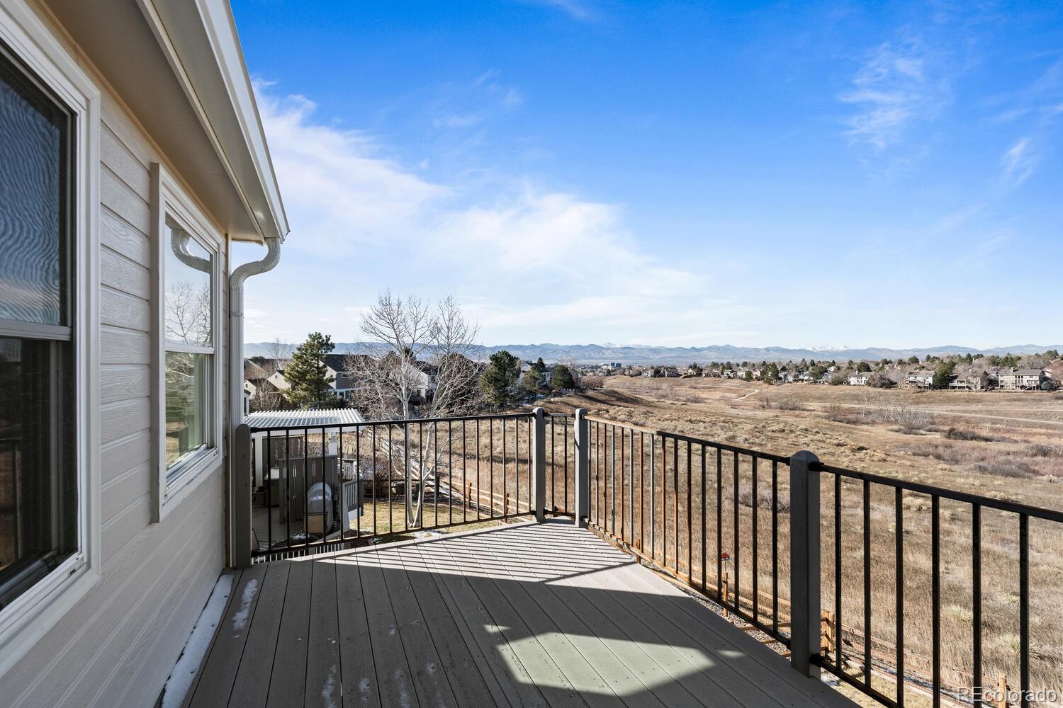 8855 South Wild Iris Run Highlands Ranch, CO 80126 - Photo 23 of 48 a view of a balcony with wooden floor space