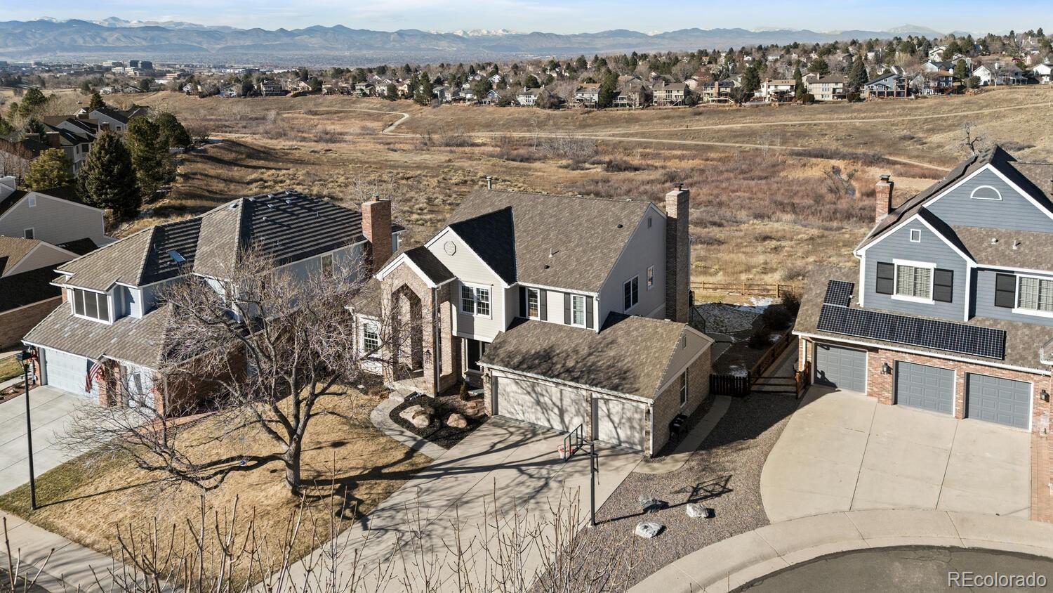 8855 South Wild Iris Run Highlands Ranch, CO 80126 - Photo 3 of 48 an aerial view of a house with a lake view
