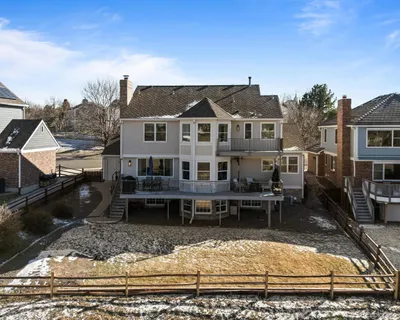a view of a house with backyard porch and sitting area