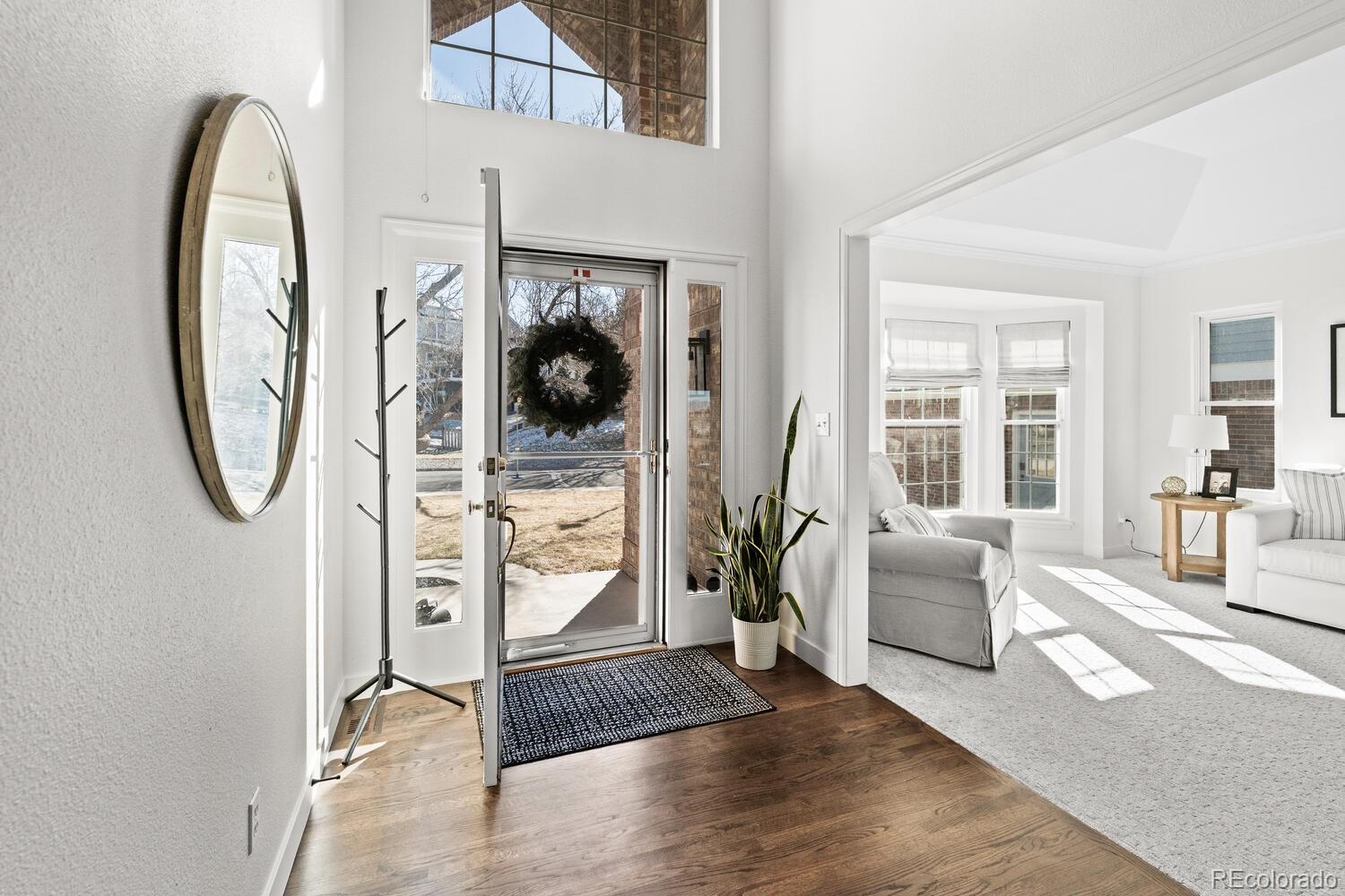 8855 South Wild Iris Run Highlands Ranch, CO 80126 - Photo 5 of 48 a view of a livingroom with furniture and entryway