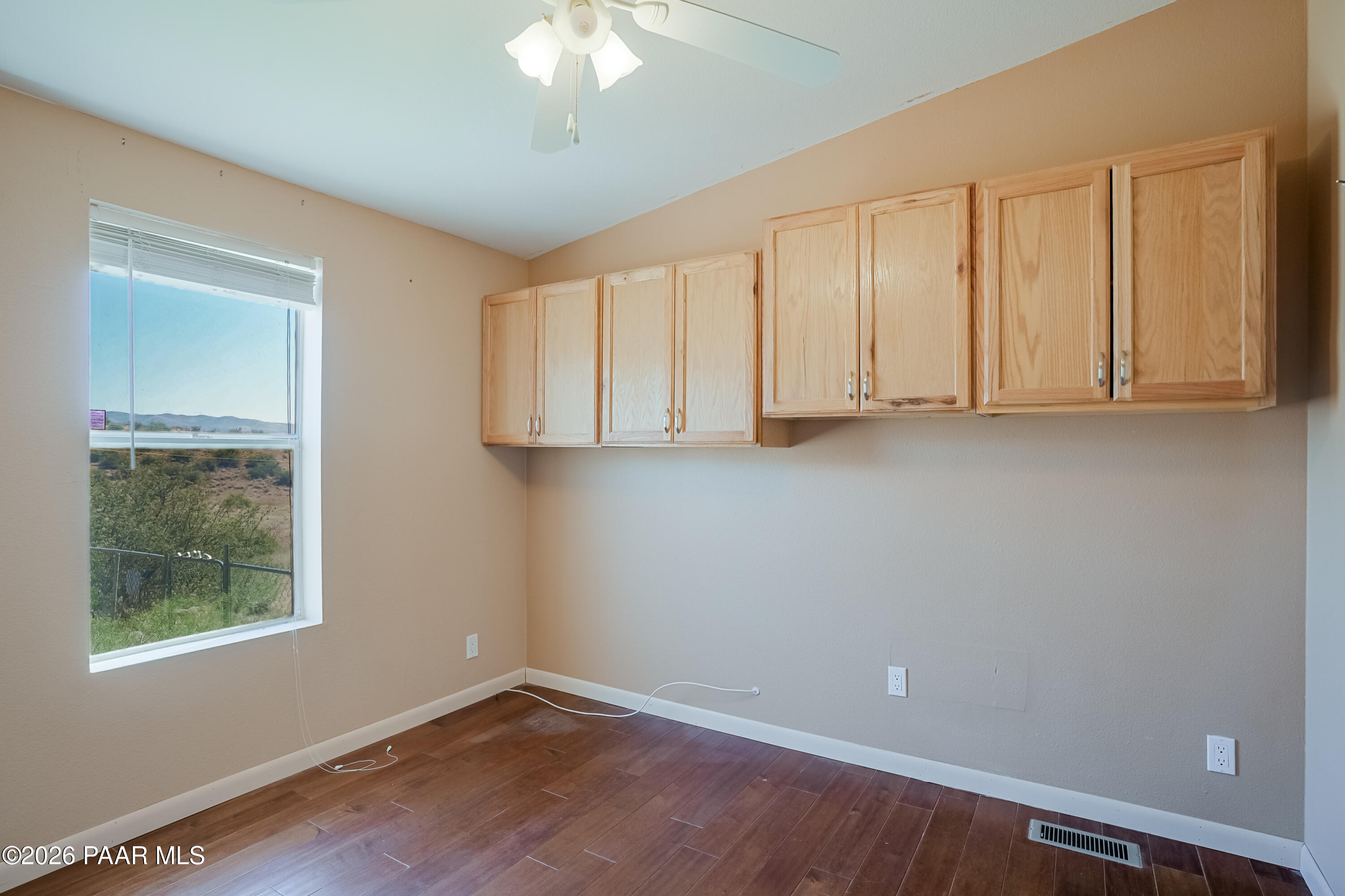 11800 Henderson Road Dewey-Humboldt, AZ 86327 - Photo 20 of 54 a view of room with window and hardwood floor