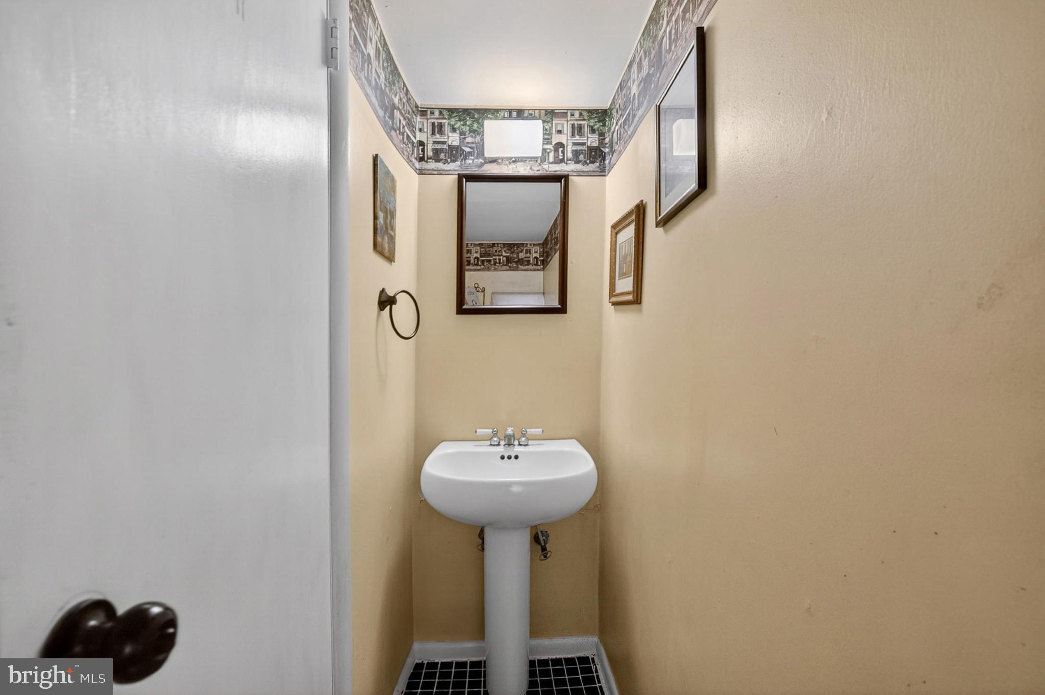 214 Waverly Road Wilmington, DE 19803 - Photo 13 of 47 Convenient 1st fl. half-bath with vintage accents.