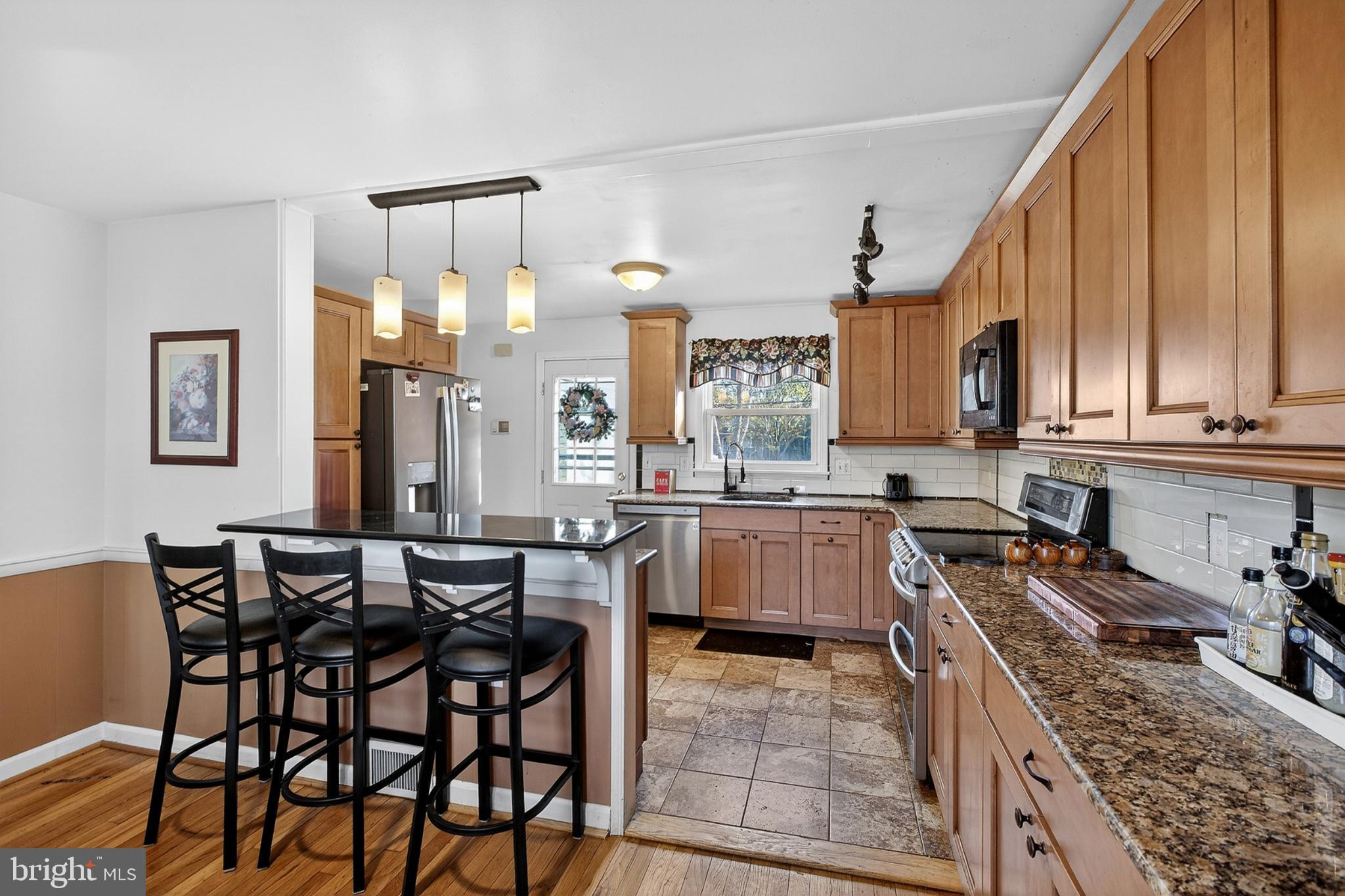 214 Waverly Road Wilmington, DE 19803 - Photo 7 of 47 Modern kitchen with warm wood accents.