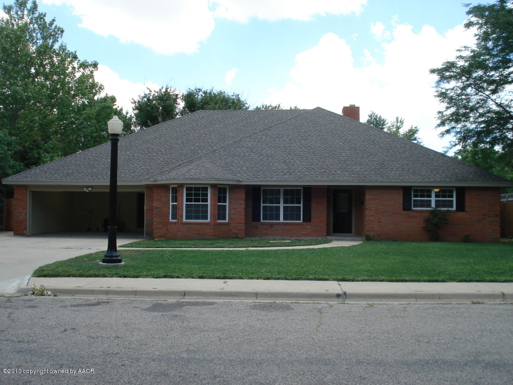 6307 Jameson Road Amarillo, TX 79106 - Photo 1 of 1 a front view of a house with a yard and garage
