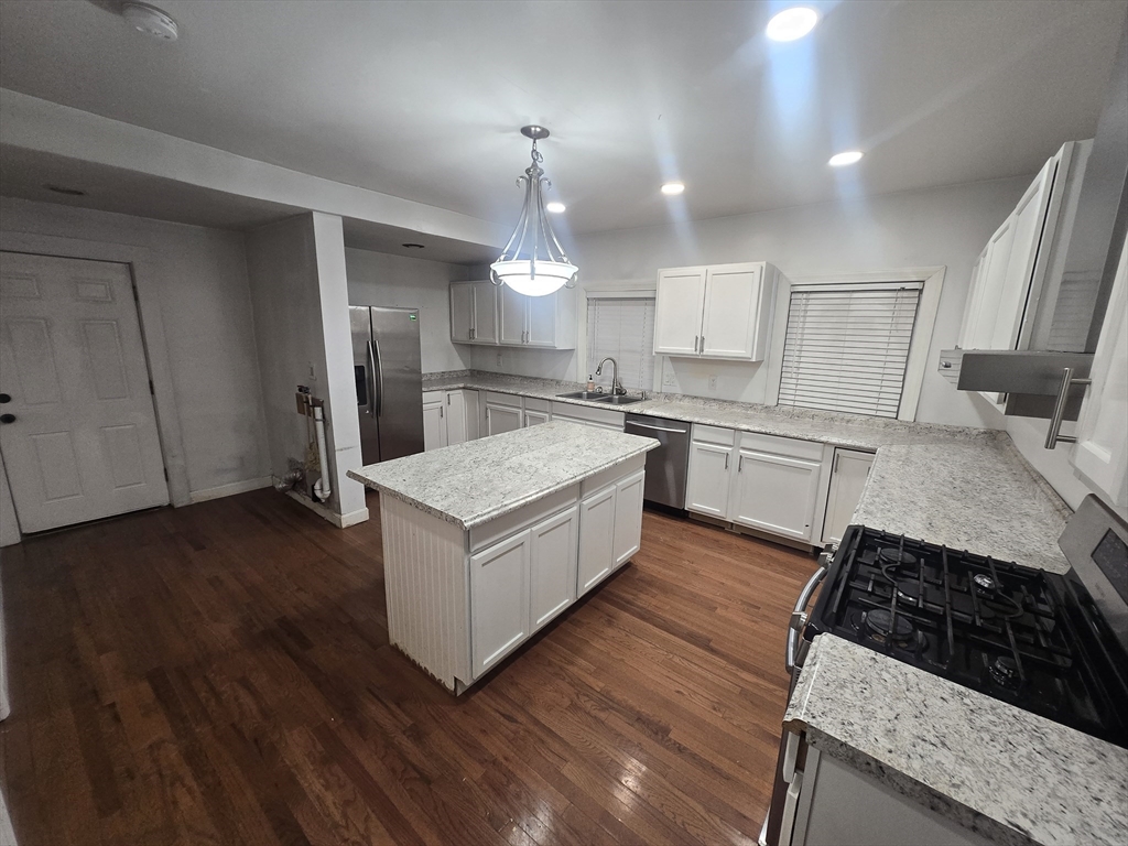 380 Grafton Street, Unit 1 Worcester, MA 01604 - Photo 2 of 8 a kitchen with a stove and a sink