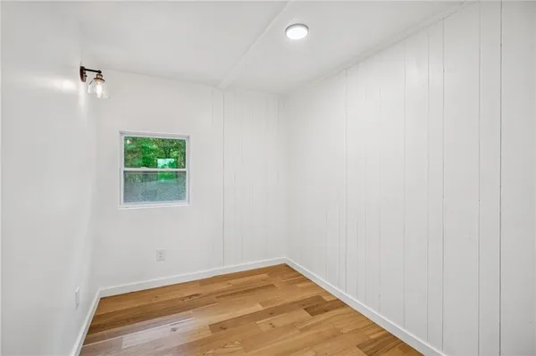 a bathroom with a granite countertop toilet a sink and a bathtub