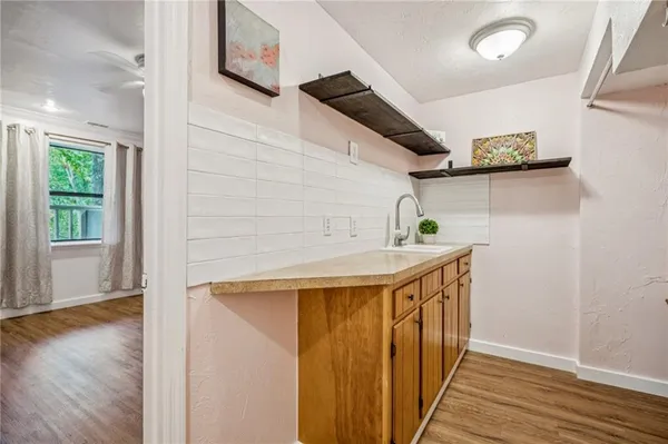 a view of an entryway with wooden floor