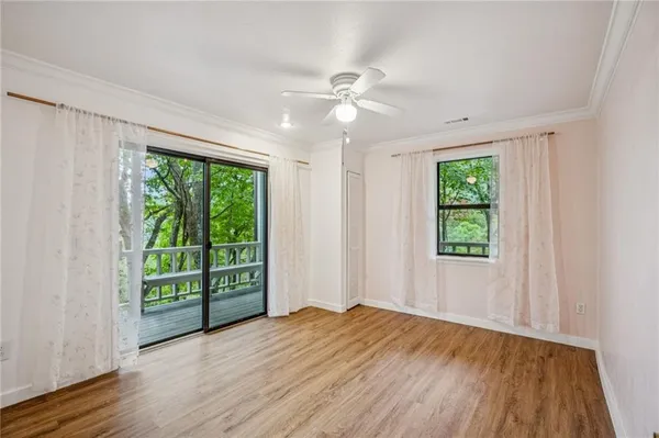 a view of balcony with wooden floor
