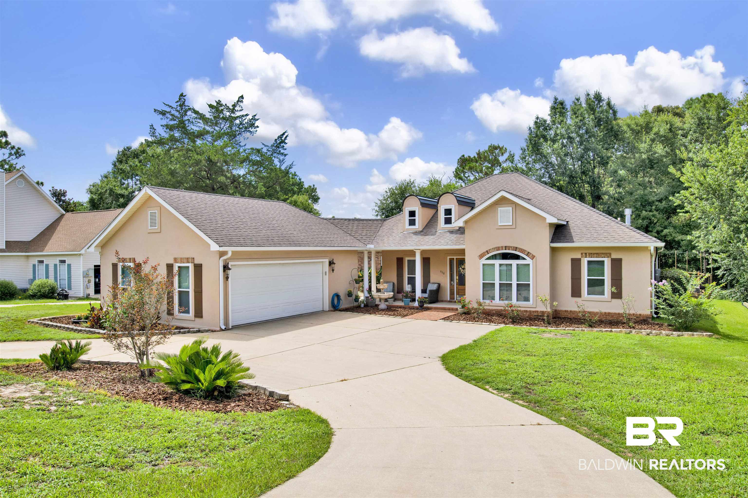 638 Southern Way Daphne, AL 36527 - Photo 1 of 26 View of front of property featuring a garage and a front lawn