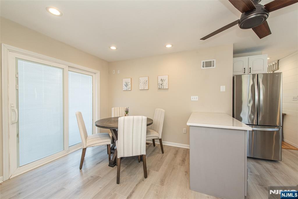 15 Orange Road Denville, NJ 07834 - Photo 11 of 24 a view of a dining room with furniture window and wooden floor