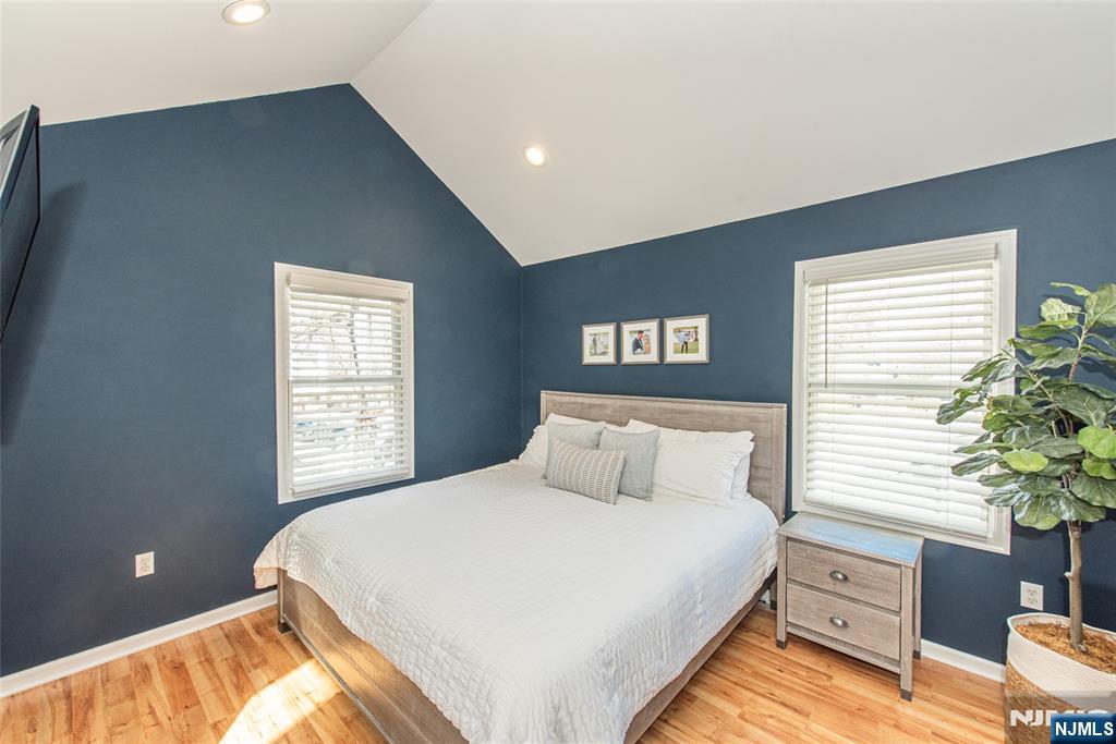 15 Orange Road Denville, NJ 07834 - Photo 13 of 24 a bedroom with a bed and a potted plant