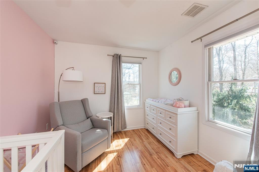 15 Orange Road Denville, NJ 07834 - Photo 18 of 24 a bedroom with furniture and windows