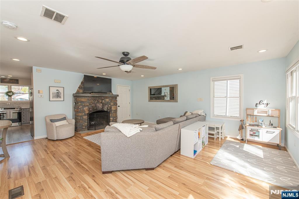 15 Orange Road Denville, NJ 07834 - Photo 4 of 24 a living room with furniture and a fireplace