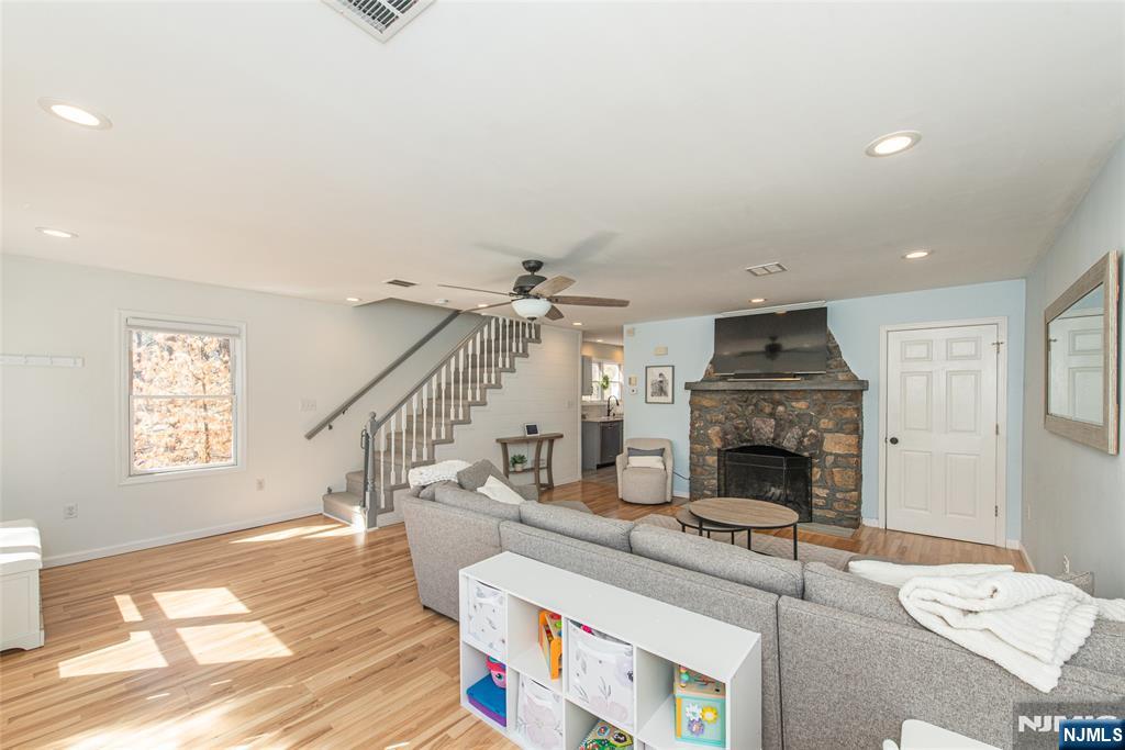 15 Orange Road Denville, NJ 07834 - Photo 5 of 24 a living room with furniture and a fireplace