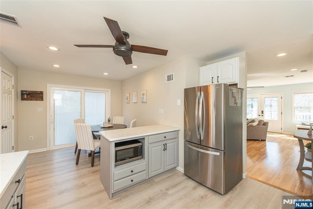 15 Orange Road Denville, NJ 07834 - Photo 9 of 24 a kitchen with a stove a refrigerator and furniture
