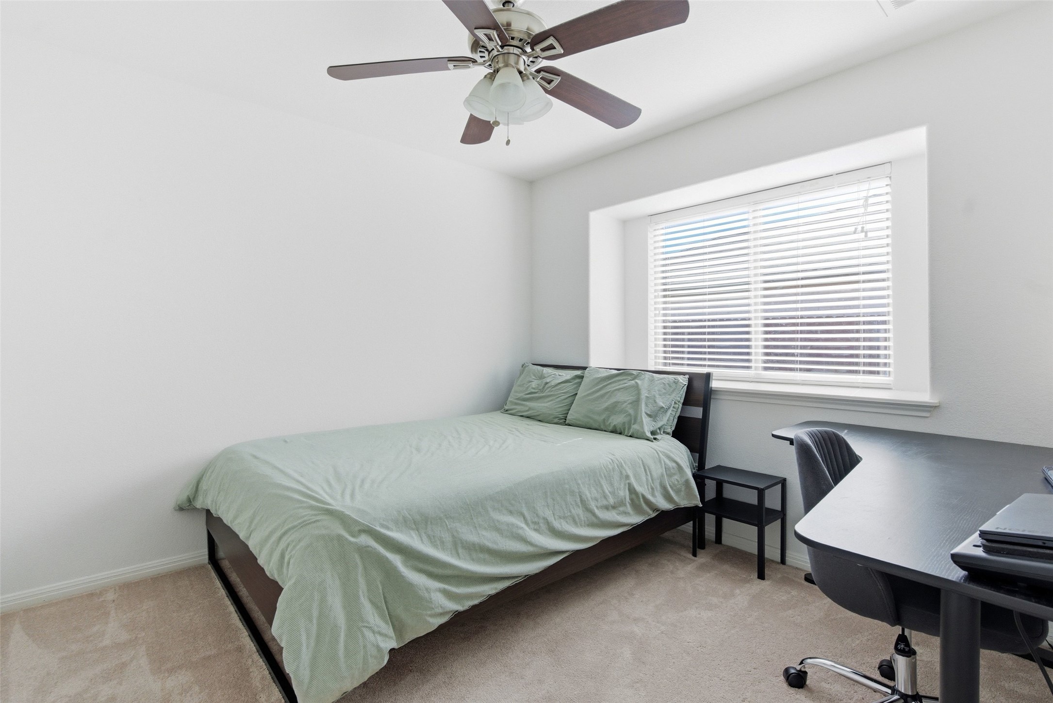 2513 Winchell Lane Austin, TX 78725 - Photo 9 of 23 a bedroom with a bed and a window