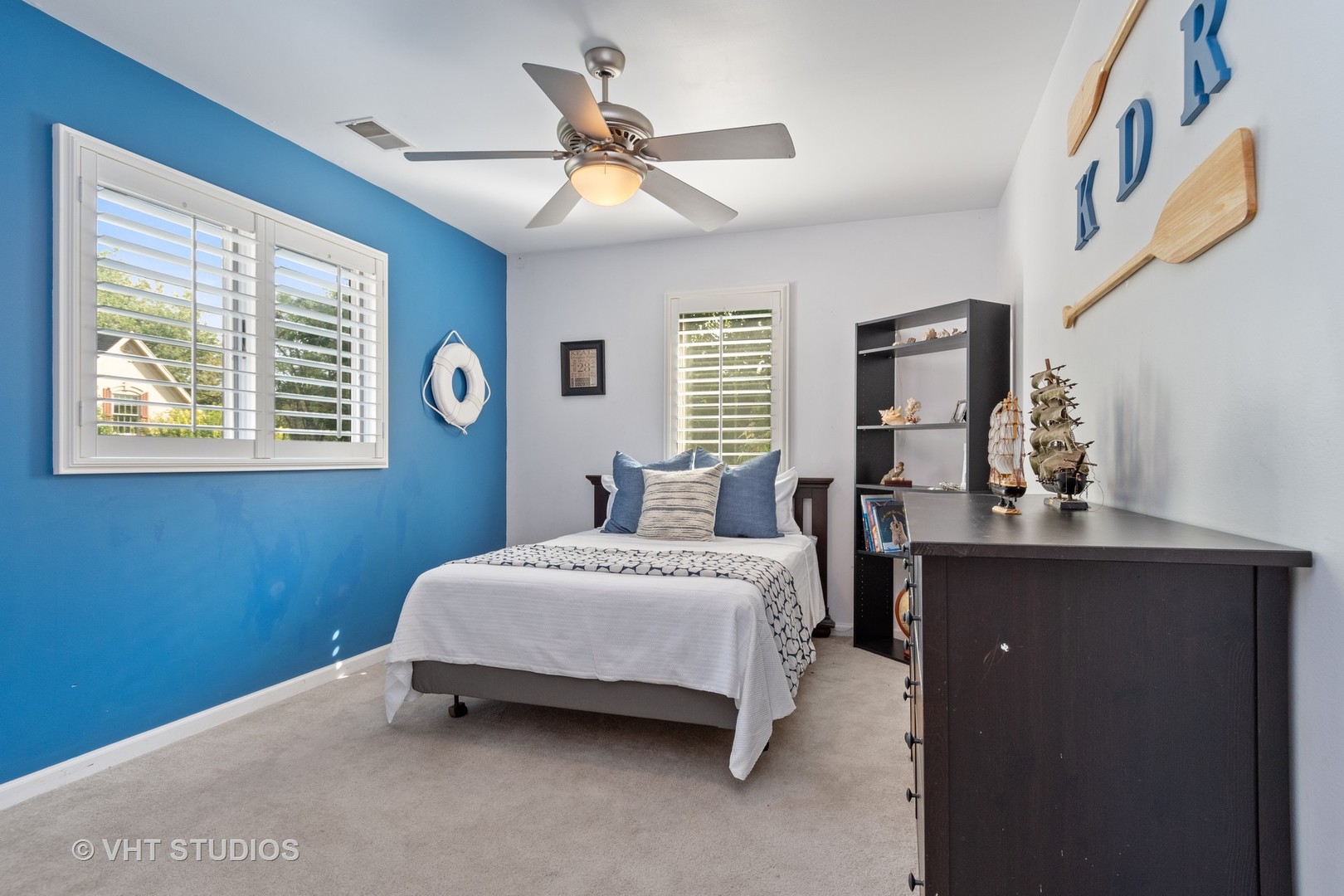 5S590 Radcliff Road Naperville, IL 60563 - Photo 14 of 27 a bedroom with a bed dresser and a window