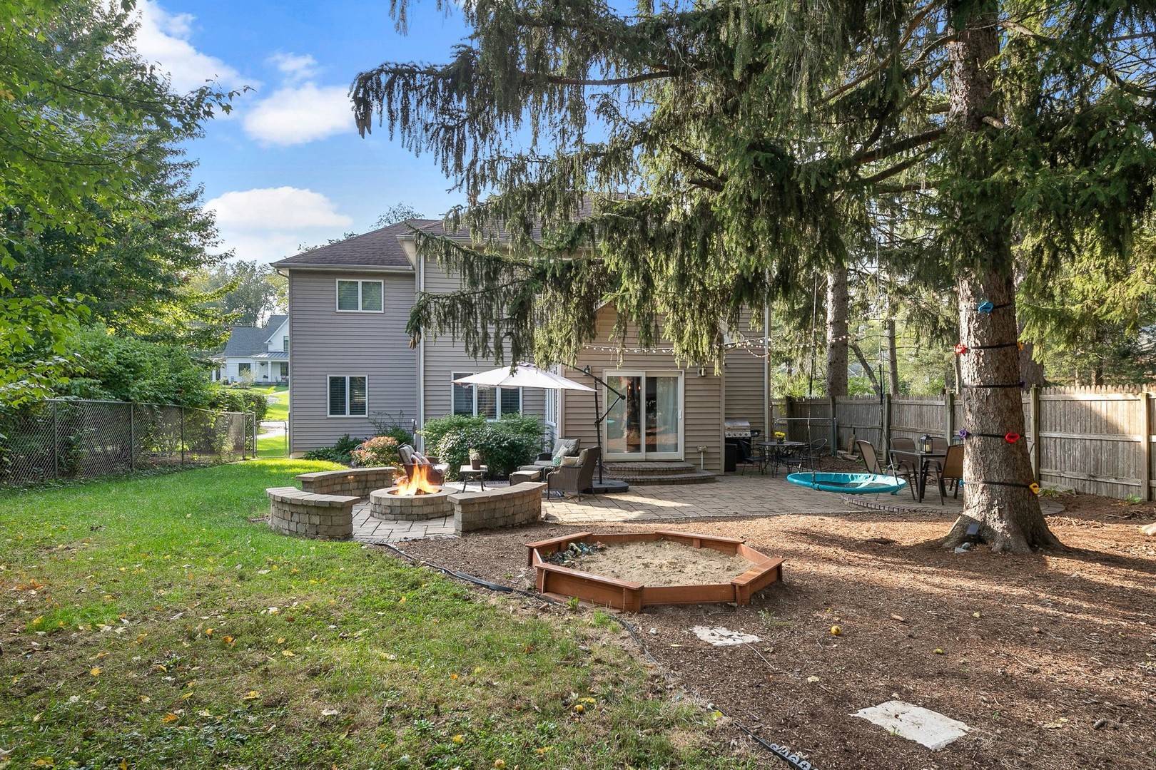 5S590 Radcliff Road Naperville, IL 60563 - Photo 22 of 27 a view of a backyard with a garden and entertaining space