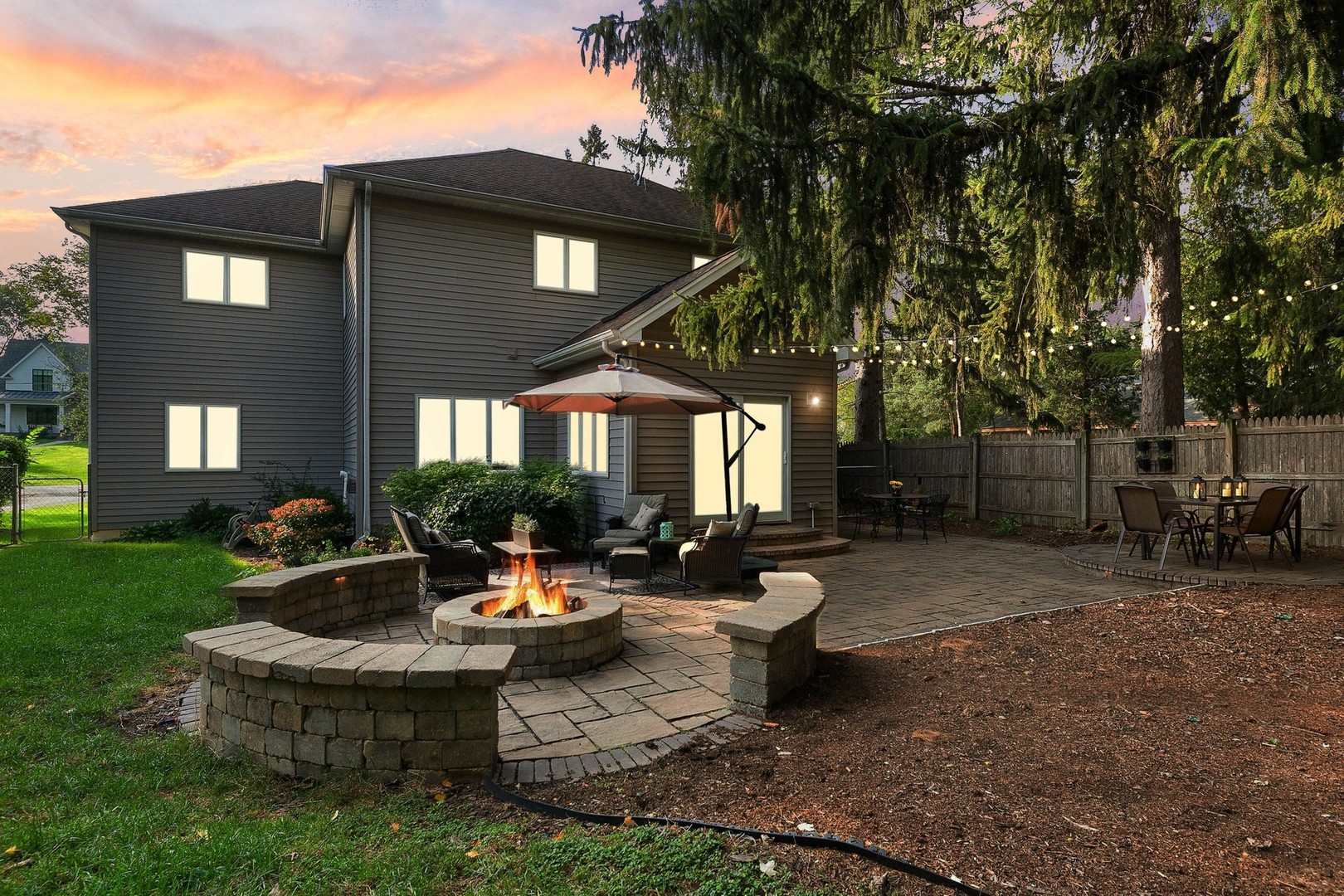 5S590 Radcliff Road Naperville, IL 60563 - Photo 23 of 27 a view of a house with backyard sitting area and garden