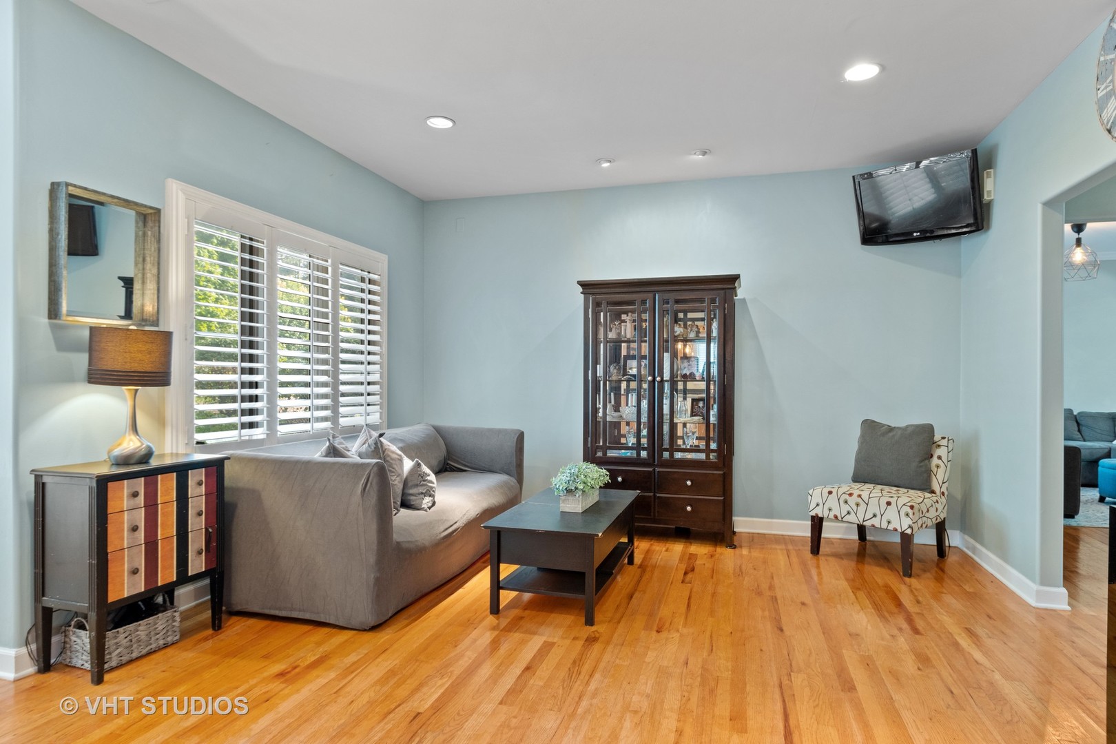 5S590 Radcliff Road Naperville, IL 60563 - Photo 8 of 27 a living room with furniture and a wooden floor