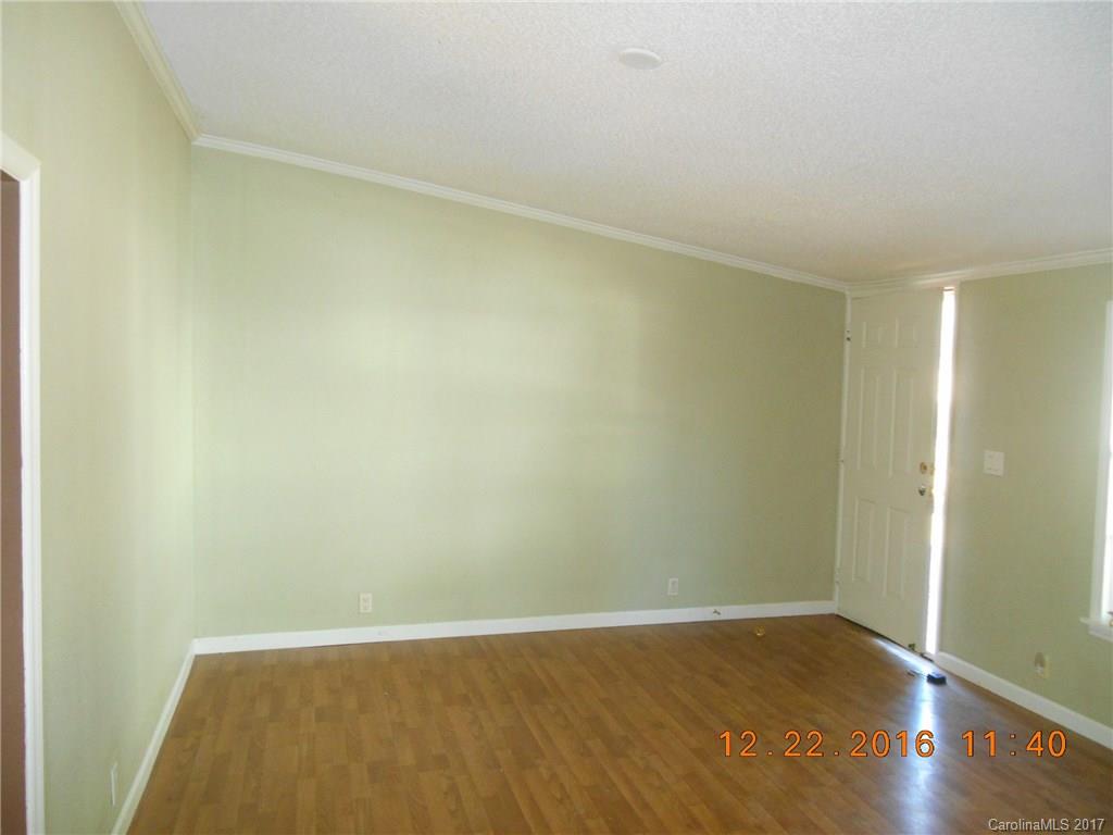 1758 Millen Road, Unit 8 Chester, SC 29706 - Photo 2 of 13 an empty room with wooden floor