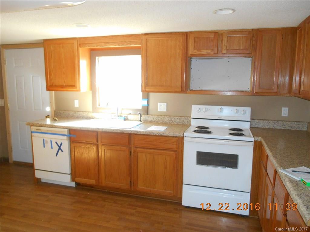 1758 Millen Road, Unit 8 Chester, SC 29706 - Photo 3 of 13 a kitchen with a stove a sink and a window