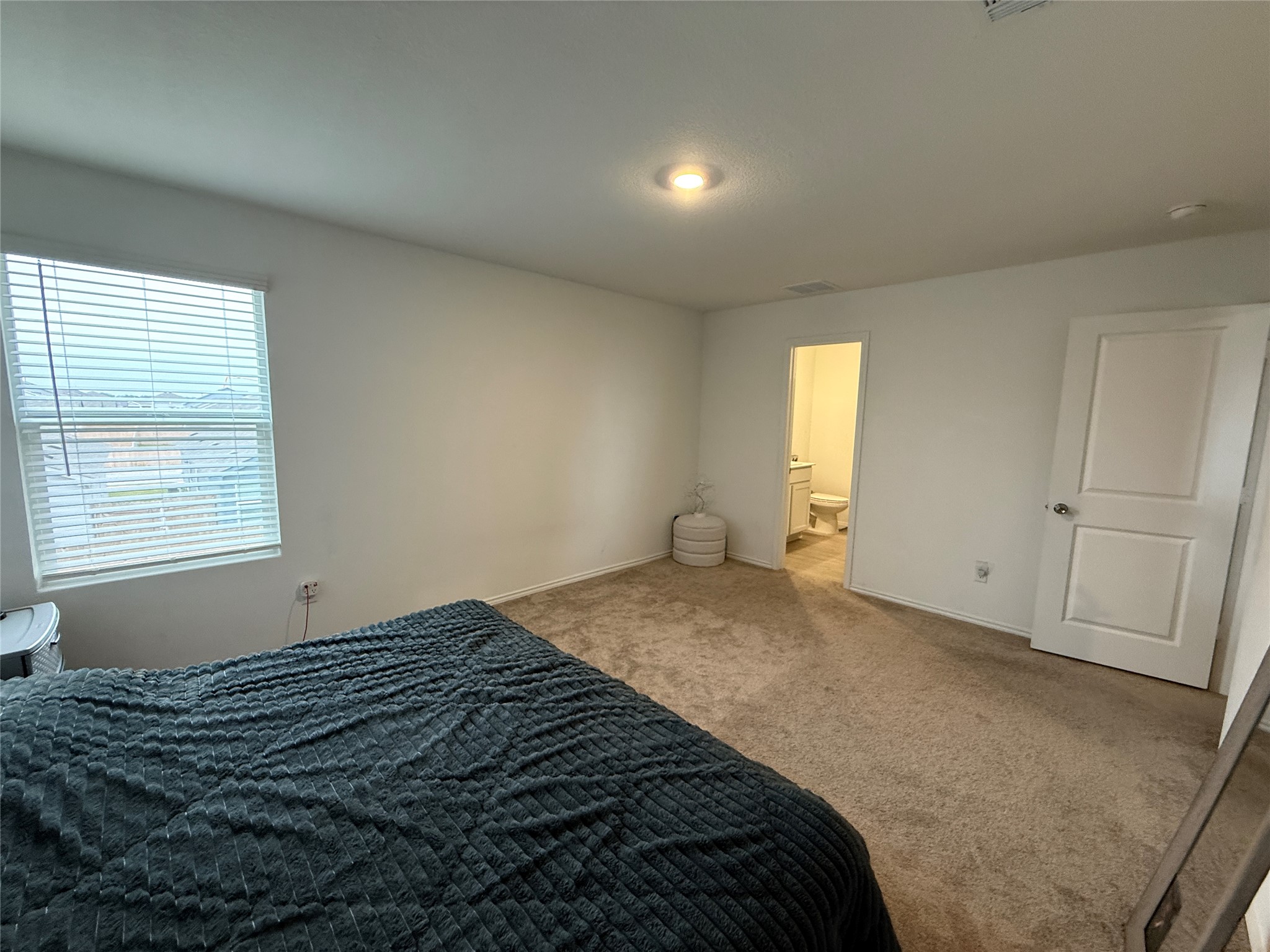 23420 Tiny Moons Way Elgin, TX 78621 - Photo 12 of 22 a bedroom with a bed and window