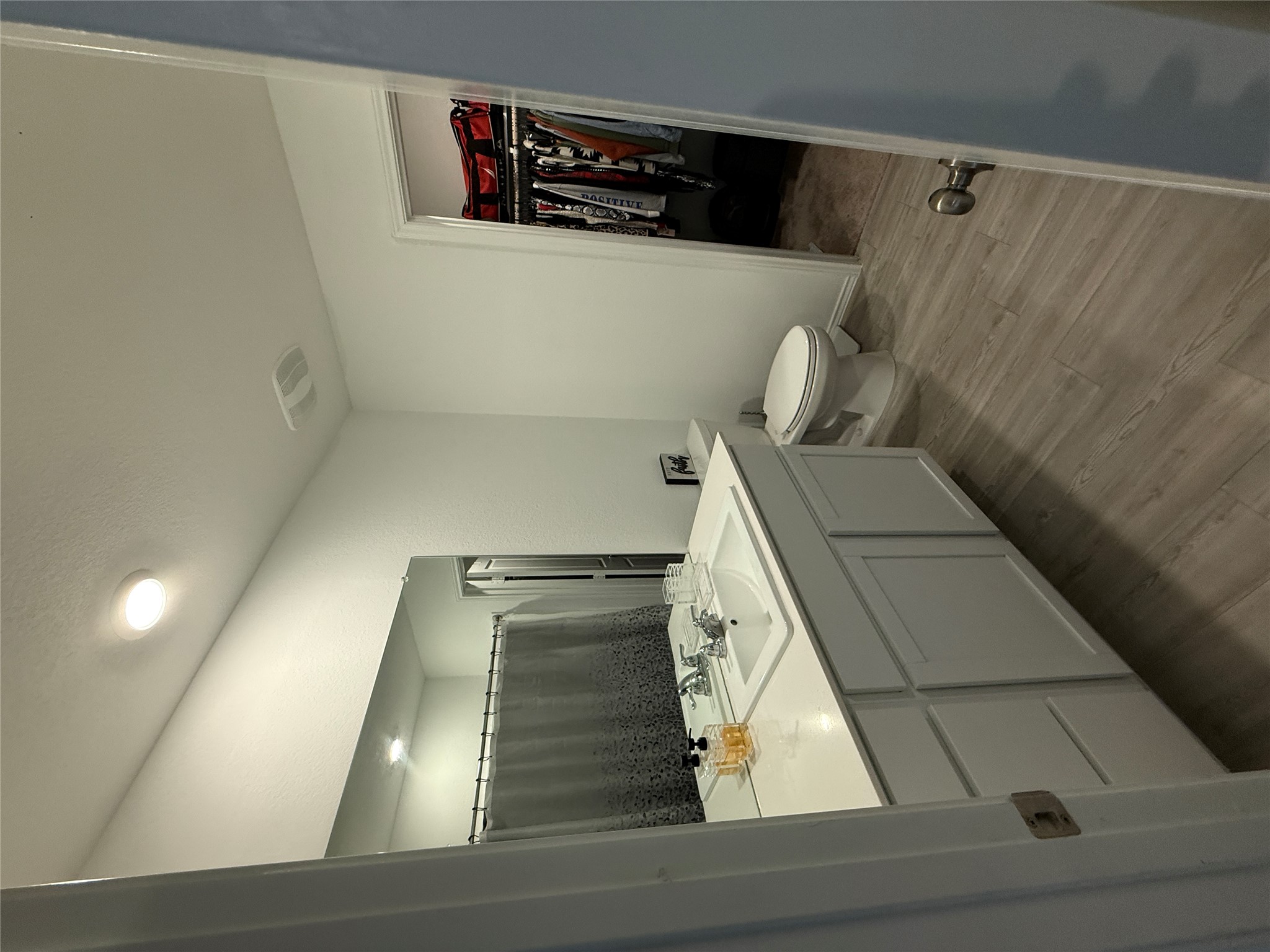 23420 Tiny Moons Way Elgin, TX 78621 - Photo 13 of 22 a bathroom with a sink a toilet and a mirror