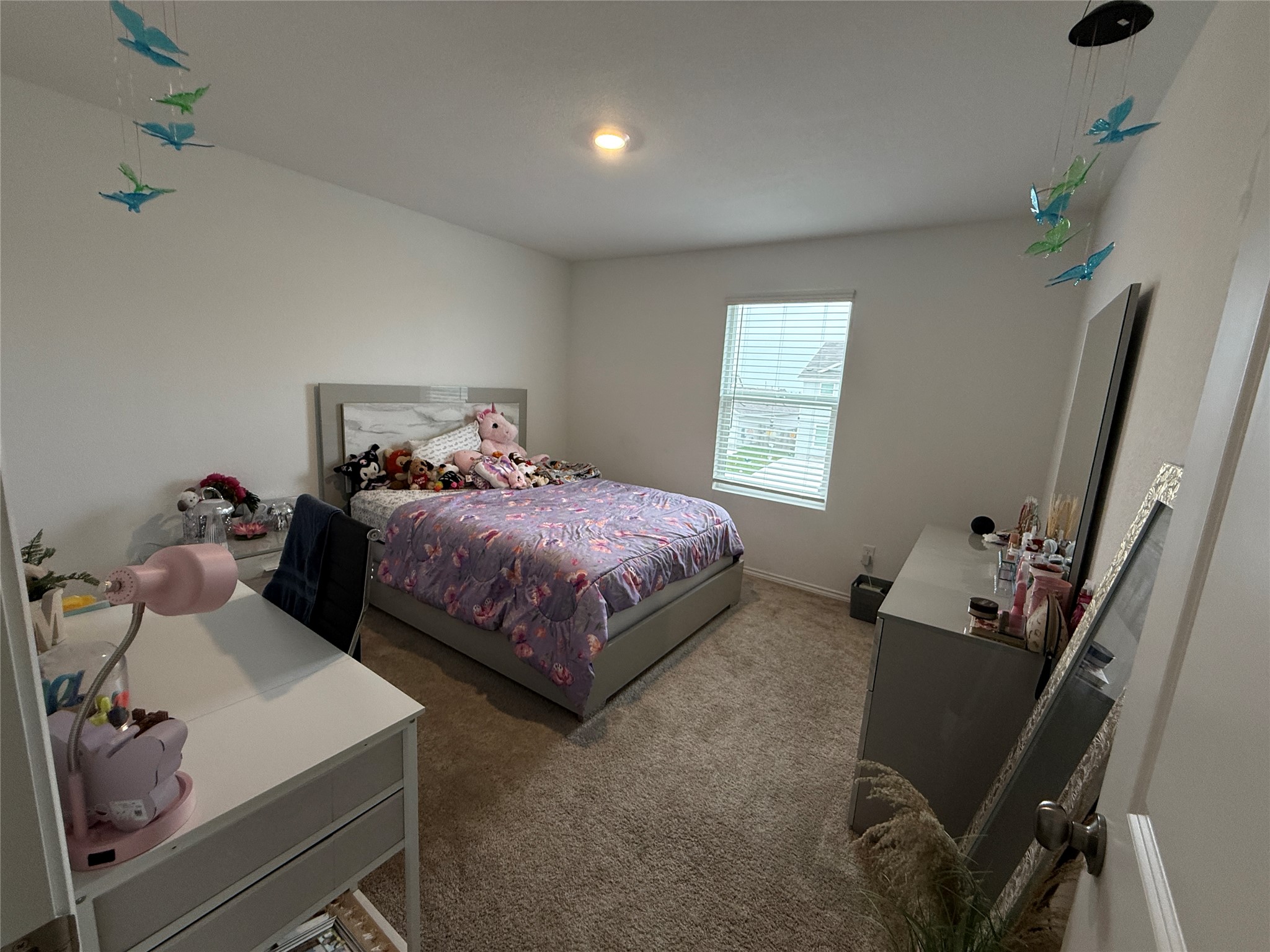 23420 Tiny Moons Way Elgin, TX 78621 - Photo 18 of 22 a bedroom with a bed and wooden floor