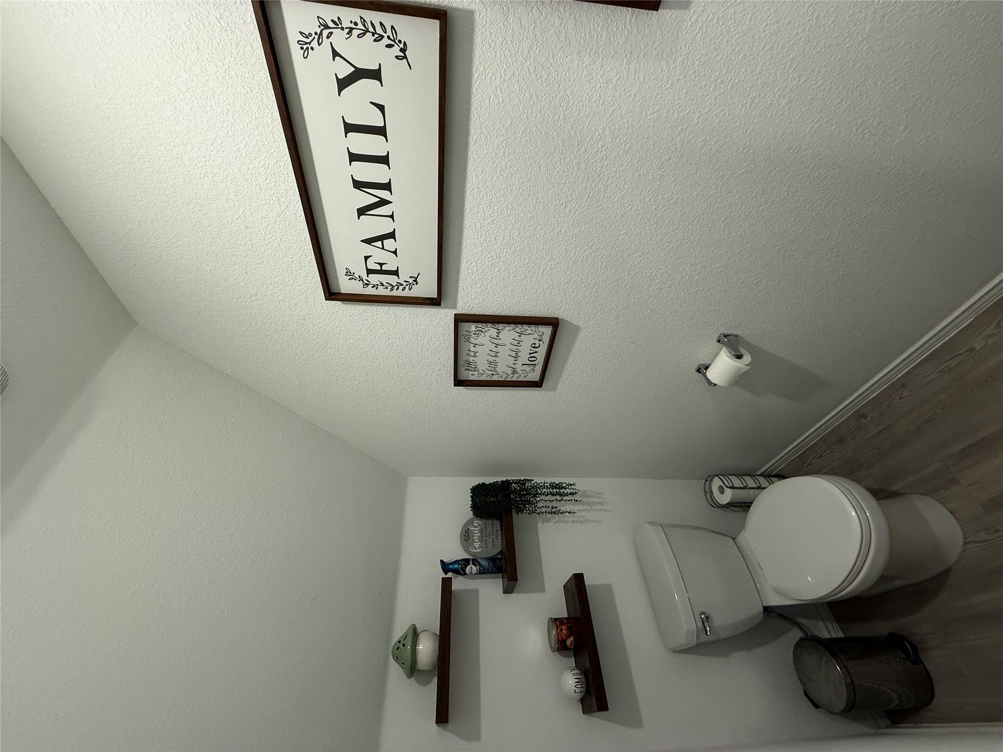 23420 Tiny Moons Way Elgin, TX 78621 - Photo 20 of 22 a bathroom with a toilet and a sink