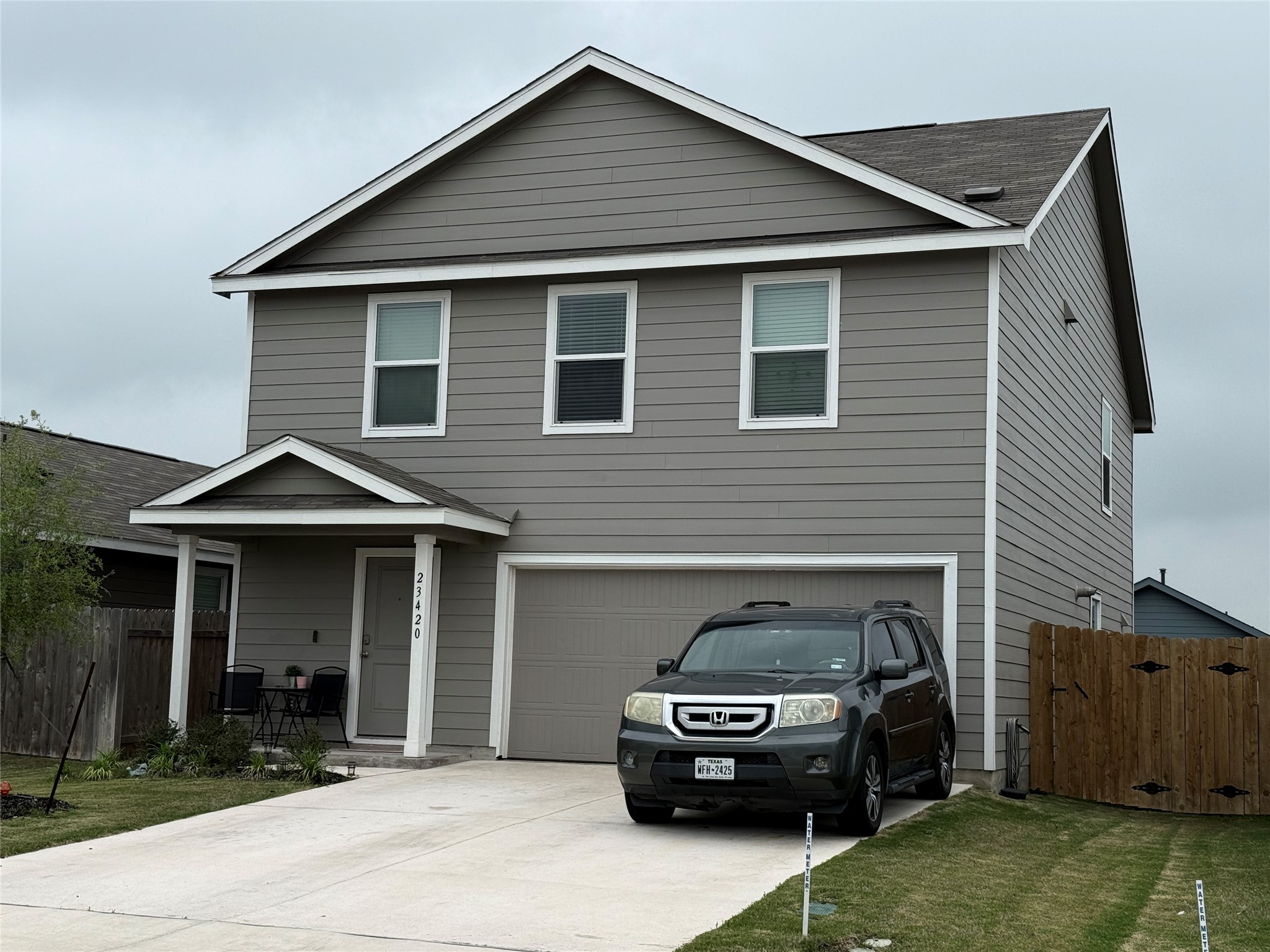 23420 Tiny Moons Way Elgin, TX 78621 - Photo 22 of 22 a front view of a house with a yard