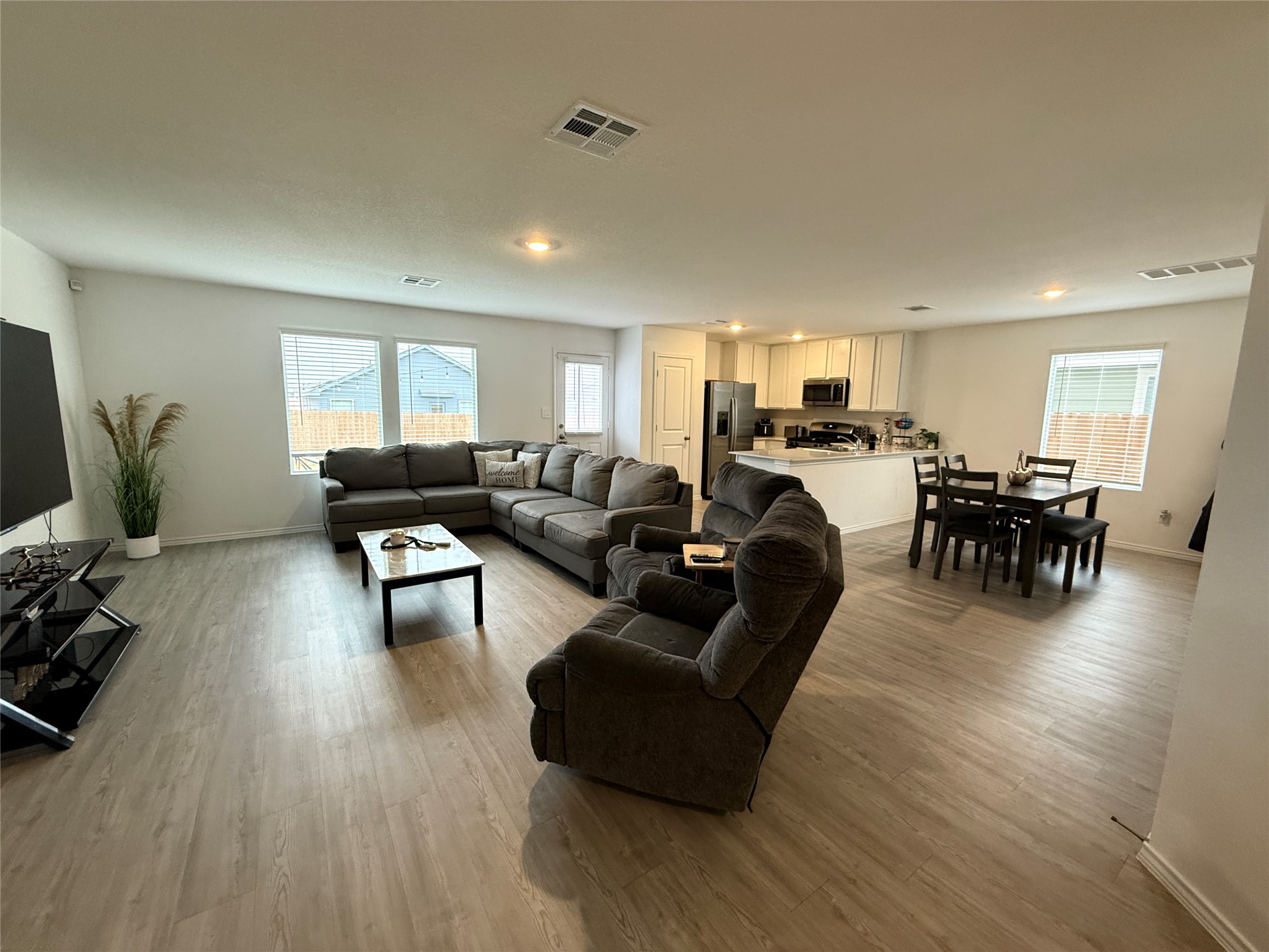 23420 Tiny Moons Way Elgin, TX 78621 - Photo 3 of 22 a living room with furniture and wooden floor