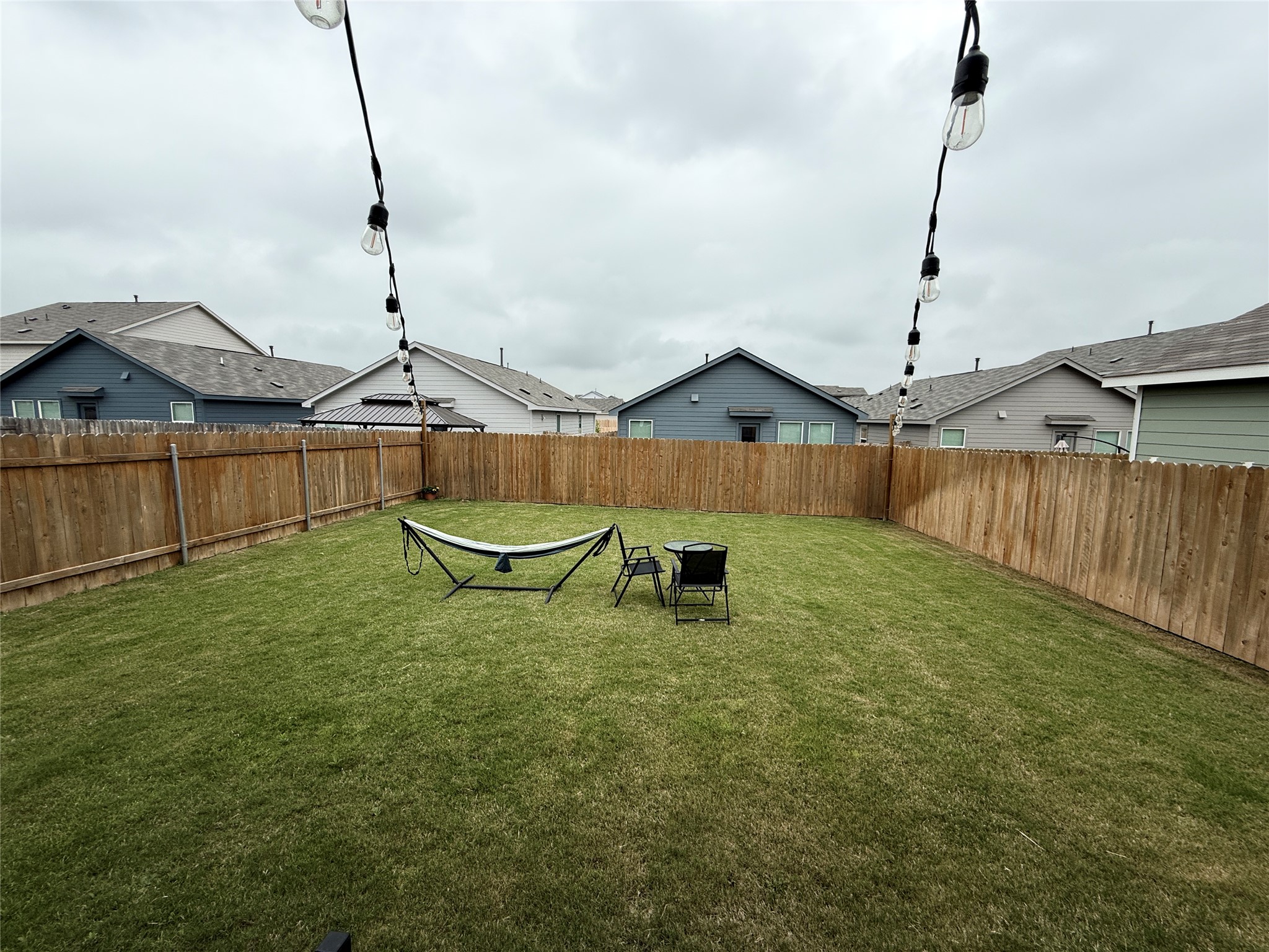 23420 Tiny Moons Way Elgin, TX 78621 - Photo 6 of 22 a backyard of a house