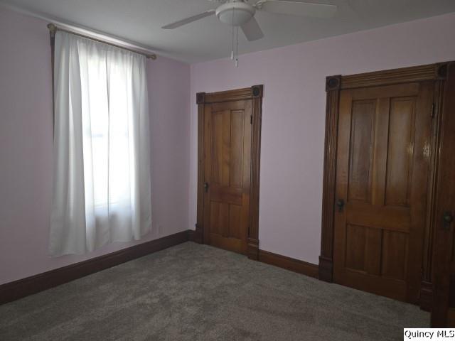 210 Main Street Carthage, IL 62321 - Photo 29 of 36 an empty room that has a window