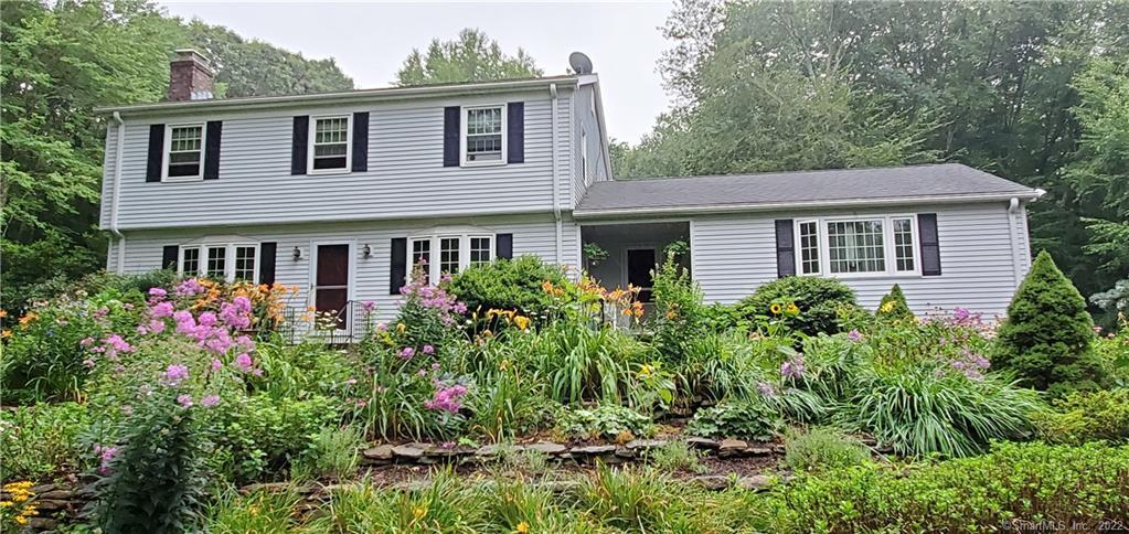 3 bedroom colonial surrounded by rock walls and gardens make for a beautiful setting.