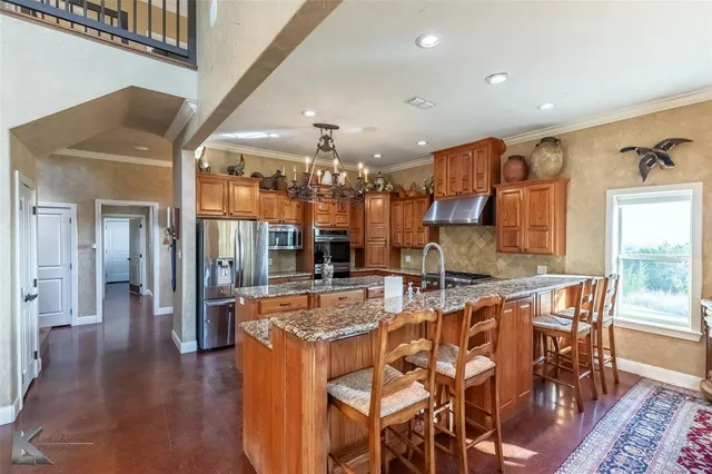 a view of a dining room kitchen with furniture and wooden floor