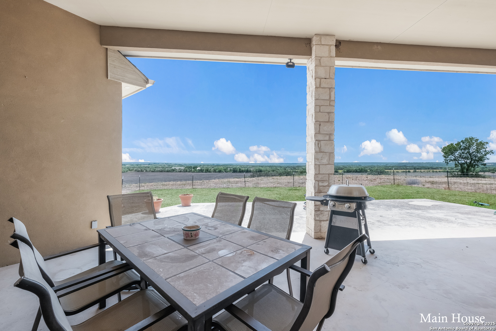 208 Private Road 378 Rio Medina, TX 78066 - Photo 13 of 30 a view of a patio with a table and chairs