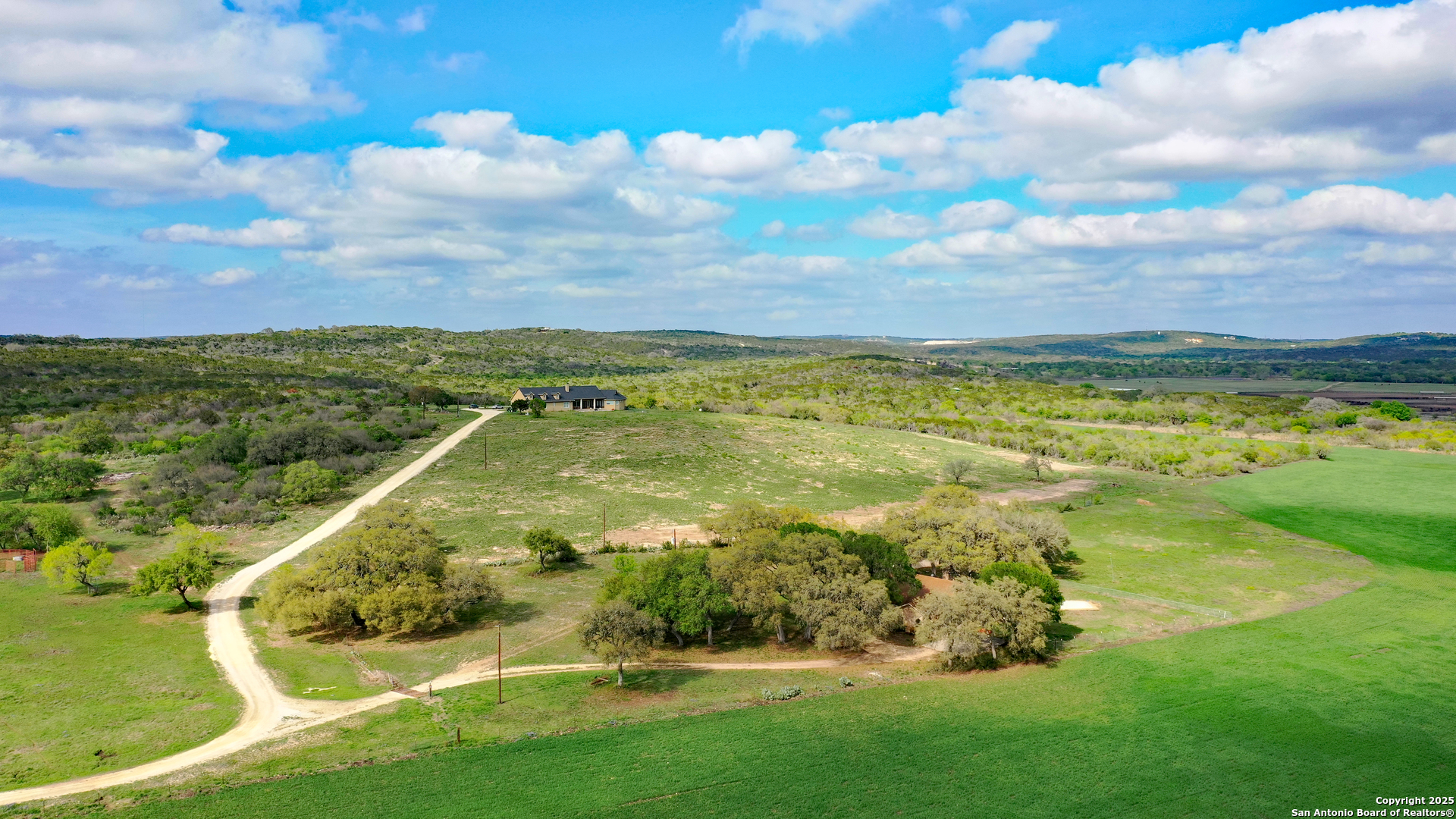 208 Private Road 378 Rio Medina, TX 78066 - Photo 15 of 30 a view of a lake with a garden