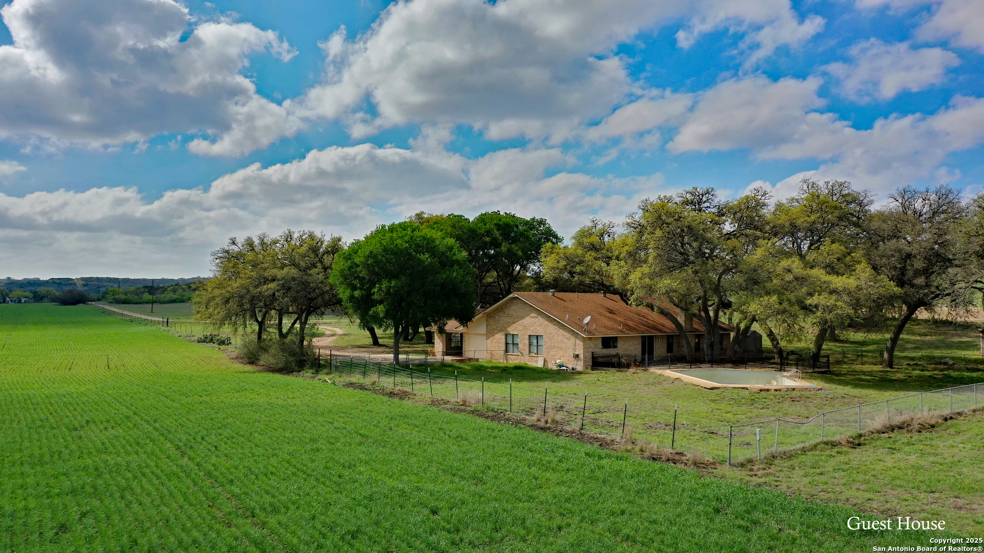 208 Private Road 378 Rio Medina, TX 78066 - Photo 18 of 30 a view of a house with backyard and garden