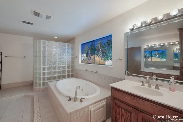 a bathroom with a shower and a sink