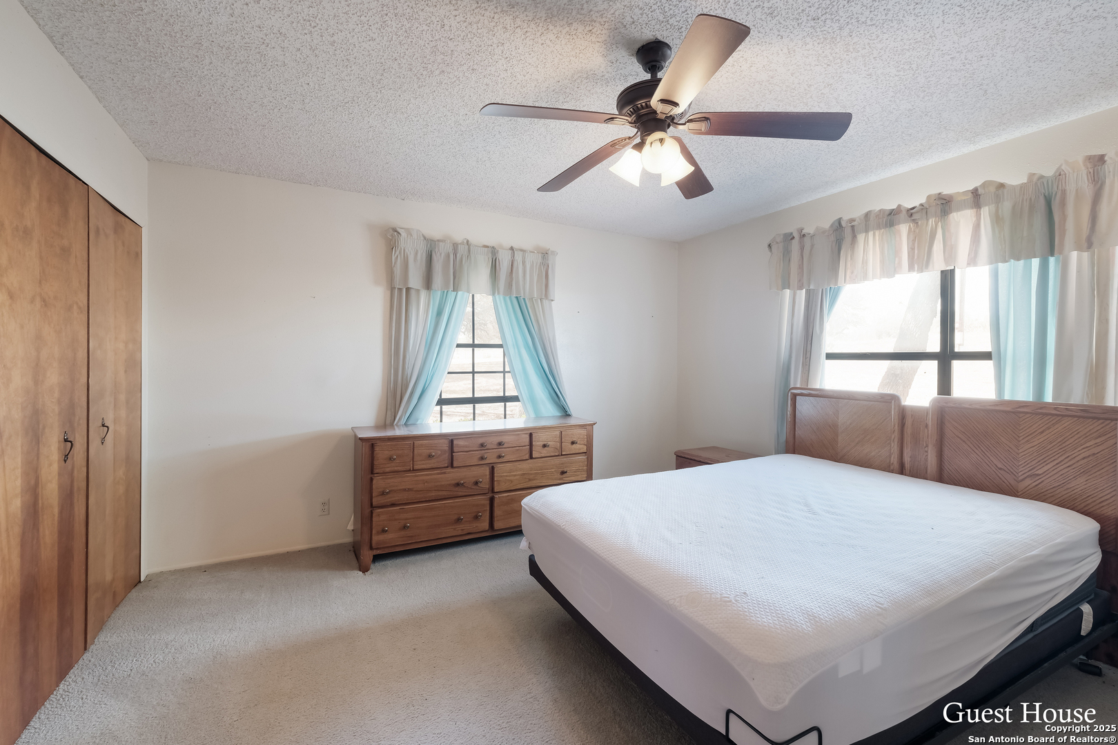 208 Private Road 378 Rio Medina, TX 78066 - Photo 24 of 30 a bedroom with a bed and a window
