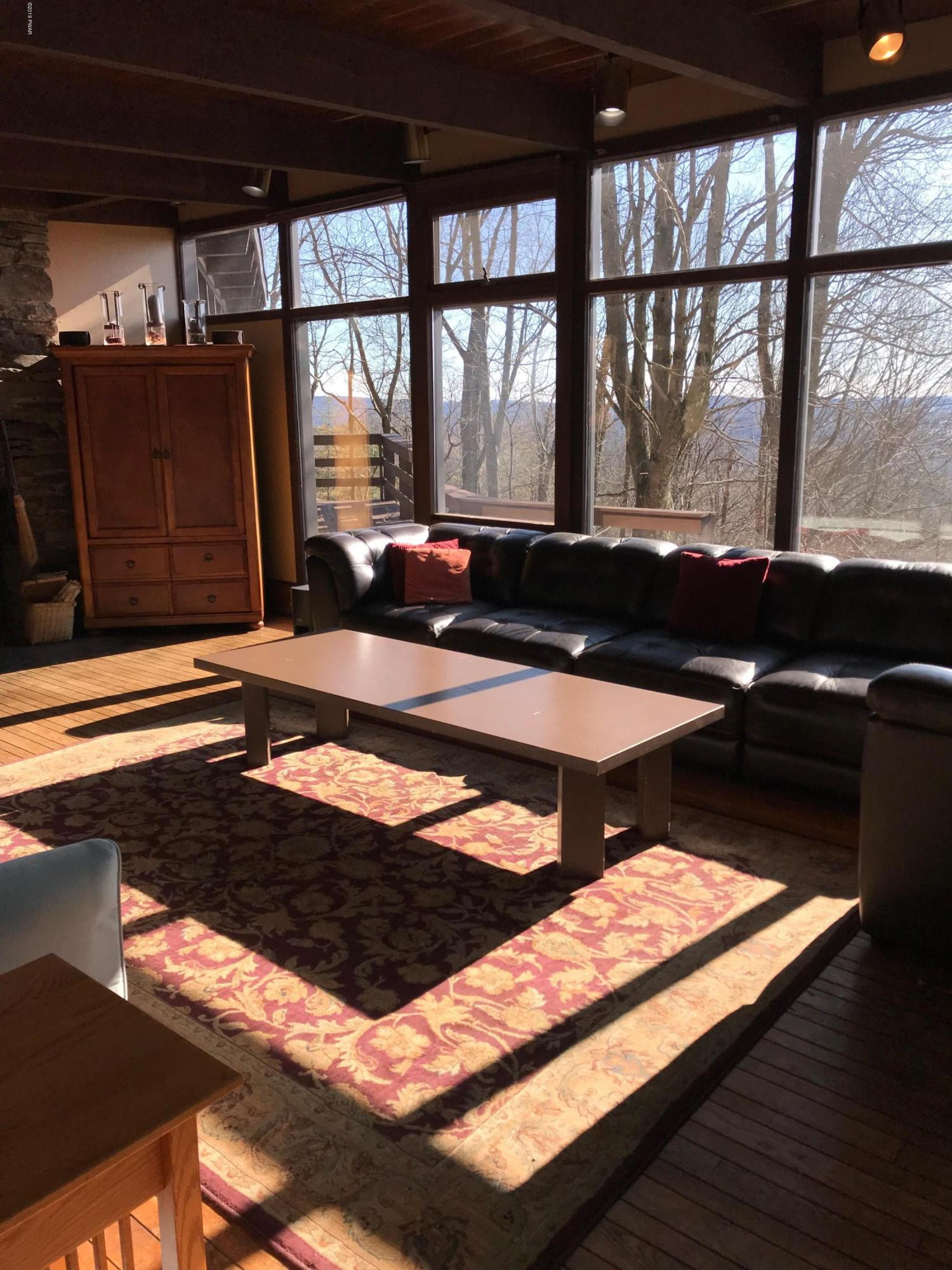 819 Wargo Road Union Dale, PA 18470 - Photo 6 of 49 a room with furniture and large windows