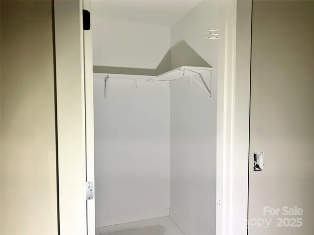 a bathroom with a shower and a door