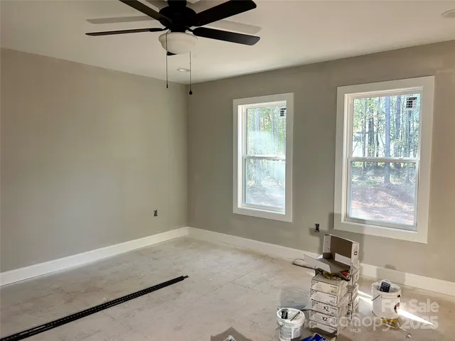 a room with gym equipment and a window