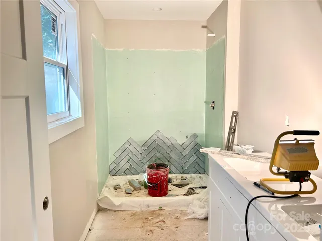 a bedroom with a bed and gym equipment