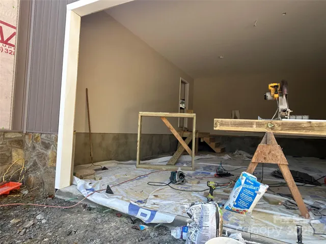 a view of dining room with a table and chairs