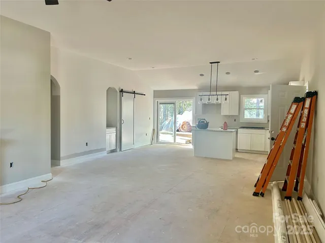 a view of a kitchen with furniture and a window