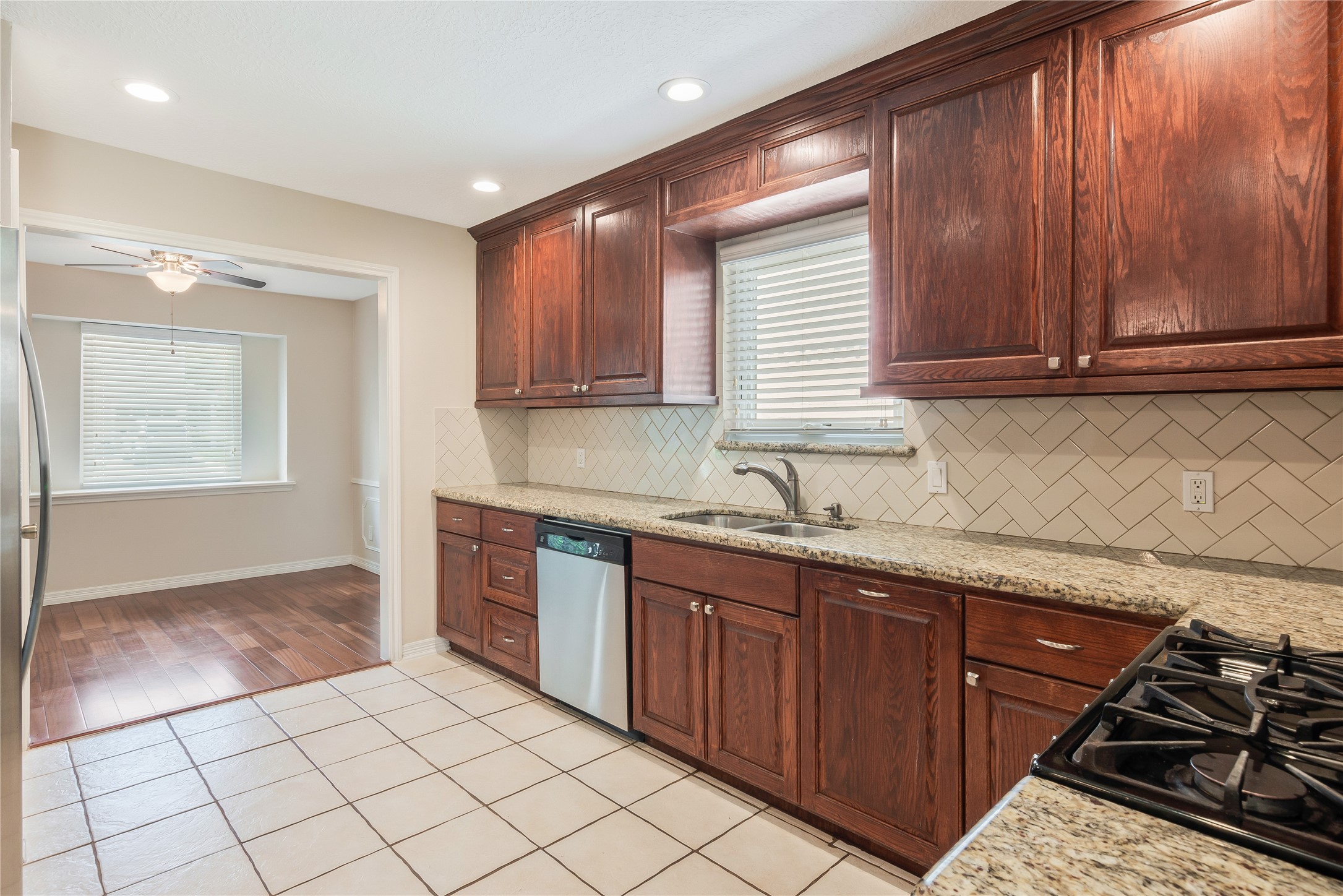 17926 Cypress Spring Drive Spring, TX 77388 - Photo 11 of 34 a kitchen with a sink stove and cabinets